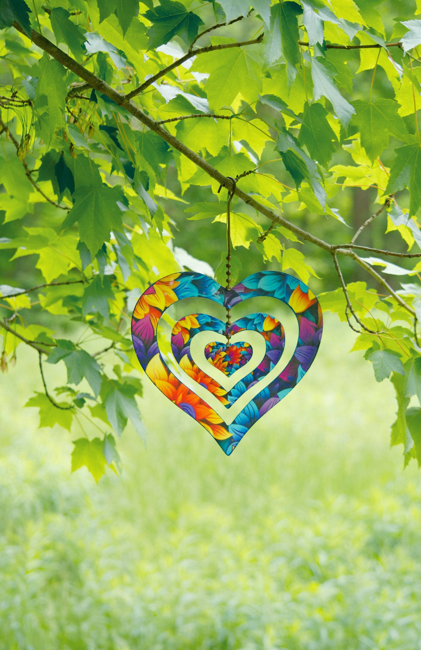 Triple Spinning Heart Multicolor Ornament - Happy Gardens