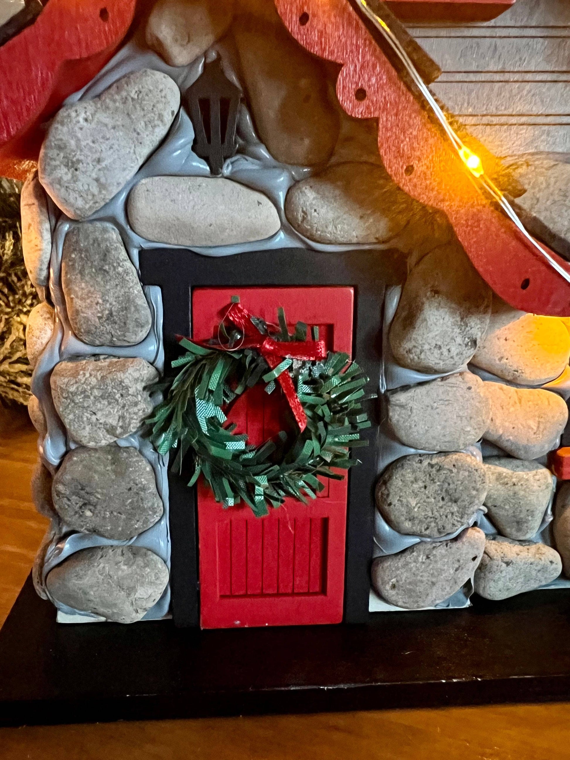 Charlevoix Stone Christmas Cottage with LED lights