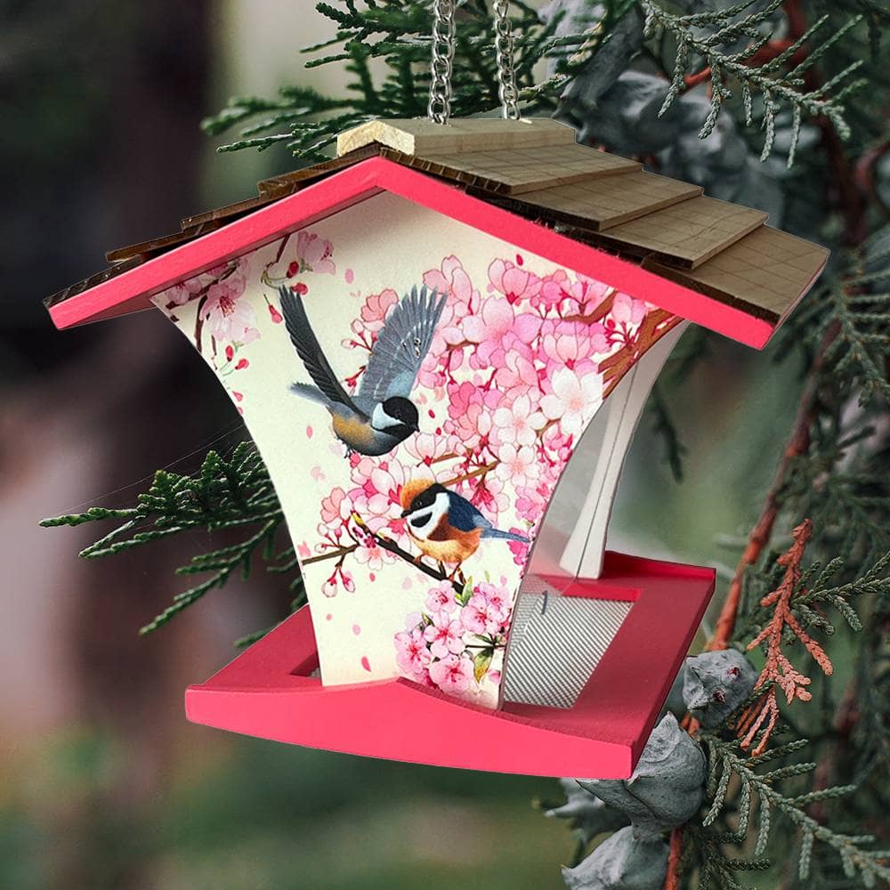 Decorative birdhouse with cherry blossoms and birds on a branch, hanging from a tree.
