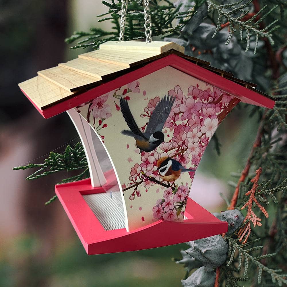 Decorative birdhouse with cherry blossom design and birds on a tree branch.