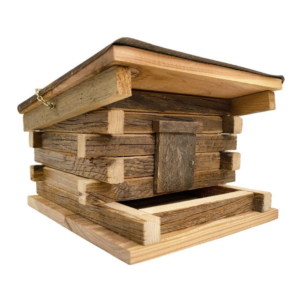 Wooden beehive design bird feeder on a white background