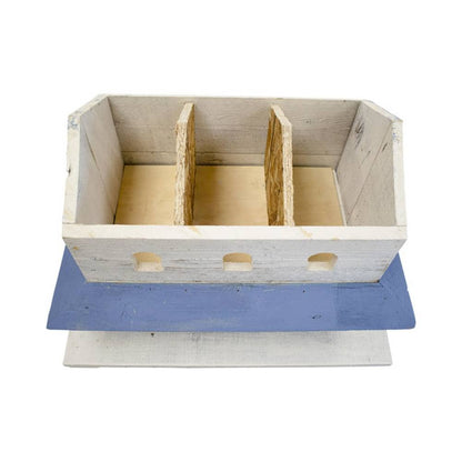 A rustic birdhouse with two vertical dividers, painted in a distressed white finish with a blue tray underneath, shown on a white background.