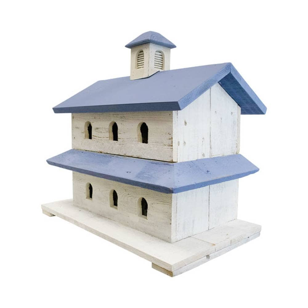 A rustic wooden birdhouse shaped like a two-story church or chapel, featuring a distressed off-white wood body and painted blue roofs, set against a plain white background.