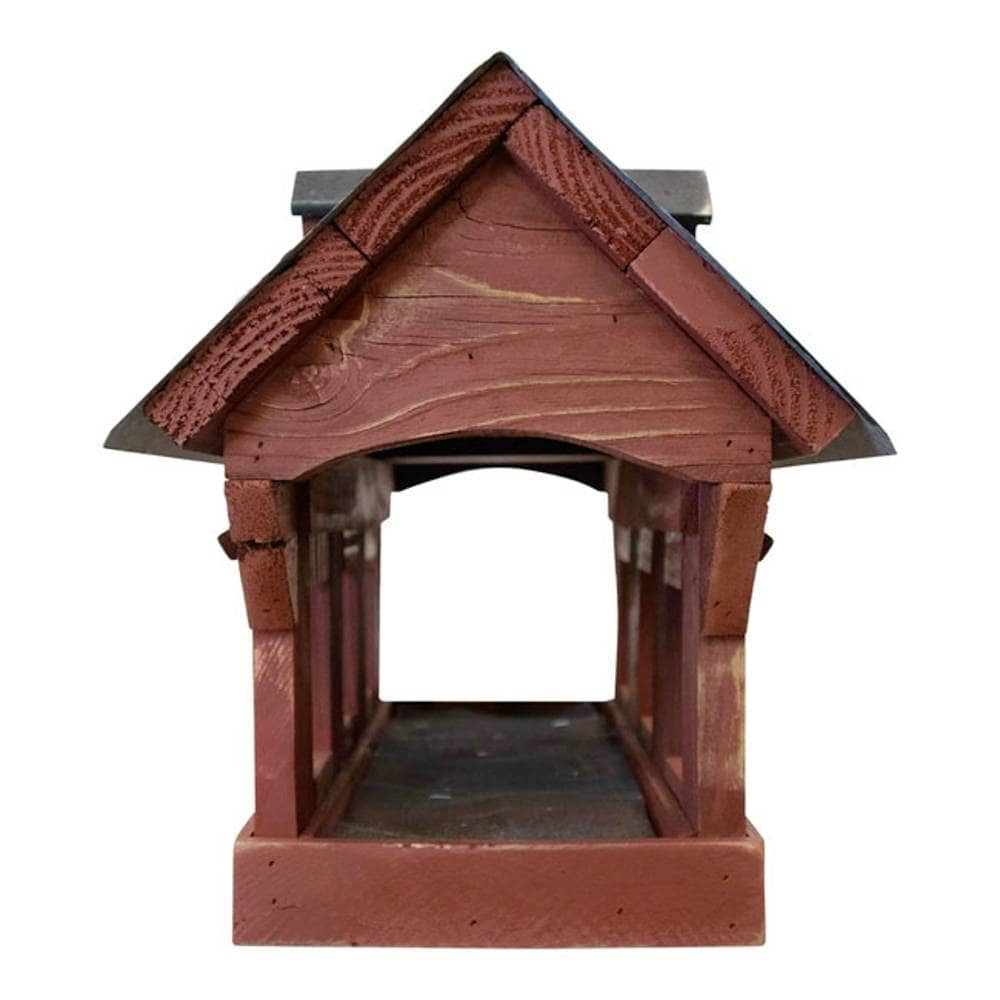 A wooden birdhouse with a reddish-brown painted finish and dark gray roof, shown against a plain white background.