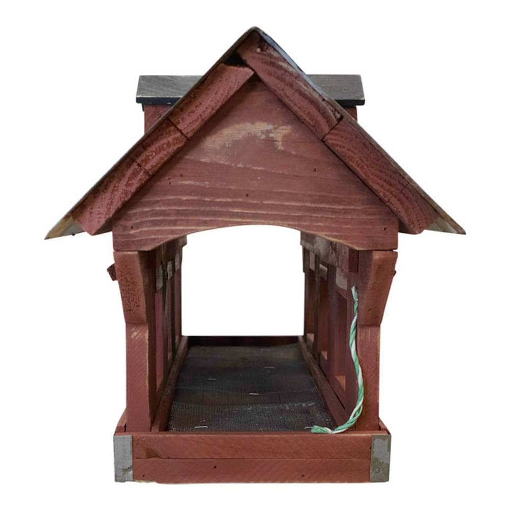 A wooden birdhouse with a reddish-brown painted finish, a dark gray roof, and a green wire hanging from the side, shown against a plain white background.