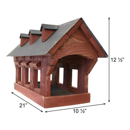 A wooden birdhouse-style feeder with a dark gray roof, shown on a white background with dimension arrows and labels indicating 21 inches width, 10 1/2 inches depth, and 12 1/2 inches height.