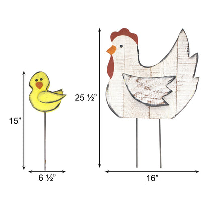 Two chicken-shaped garden stakes shown on a white background with dimension arrows and labels: a small yellow duck on the left labeled 15 inches tall by 6 1/2 inches wide, and a larger white chicken on the right labeled 25 1/2 inches tall by 16 inches wide.