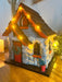 Charlevoix Stone Christmas Cottage with LED lights